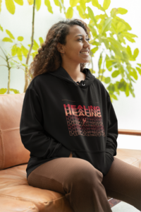 pullover-hoodie-mockup-of-a-smiling-woman-with-curly-hair-sitting-on-a-couch-m28751